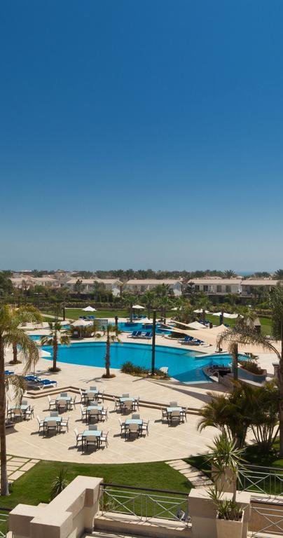 Jaz Little Venice Golf Resort Ain Sukhna Bagian luar foto View of the pool at the Al Hamra Golf Club